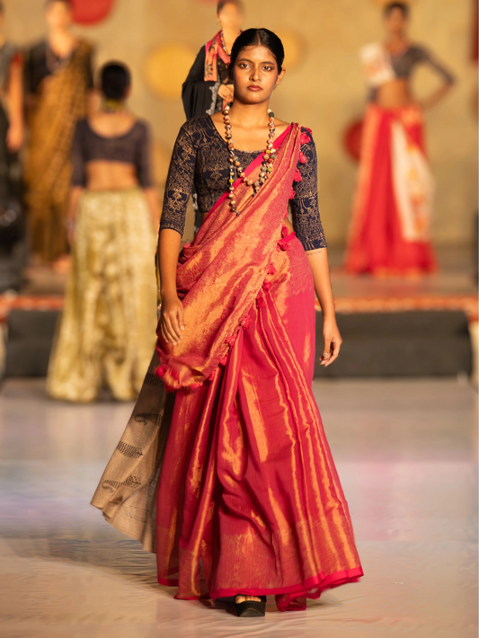 Model walking on a fashion show runway wearing a traditional saree. Bani Thani Noorani Saree by Soulweaves