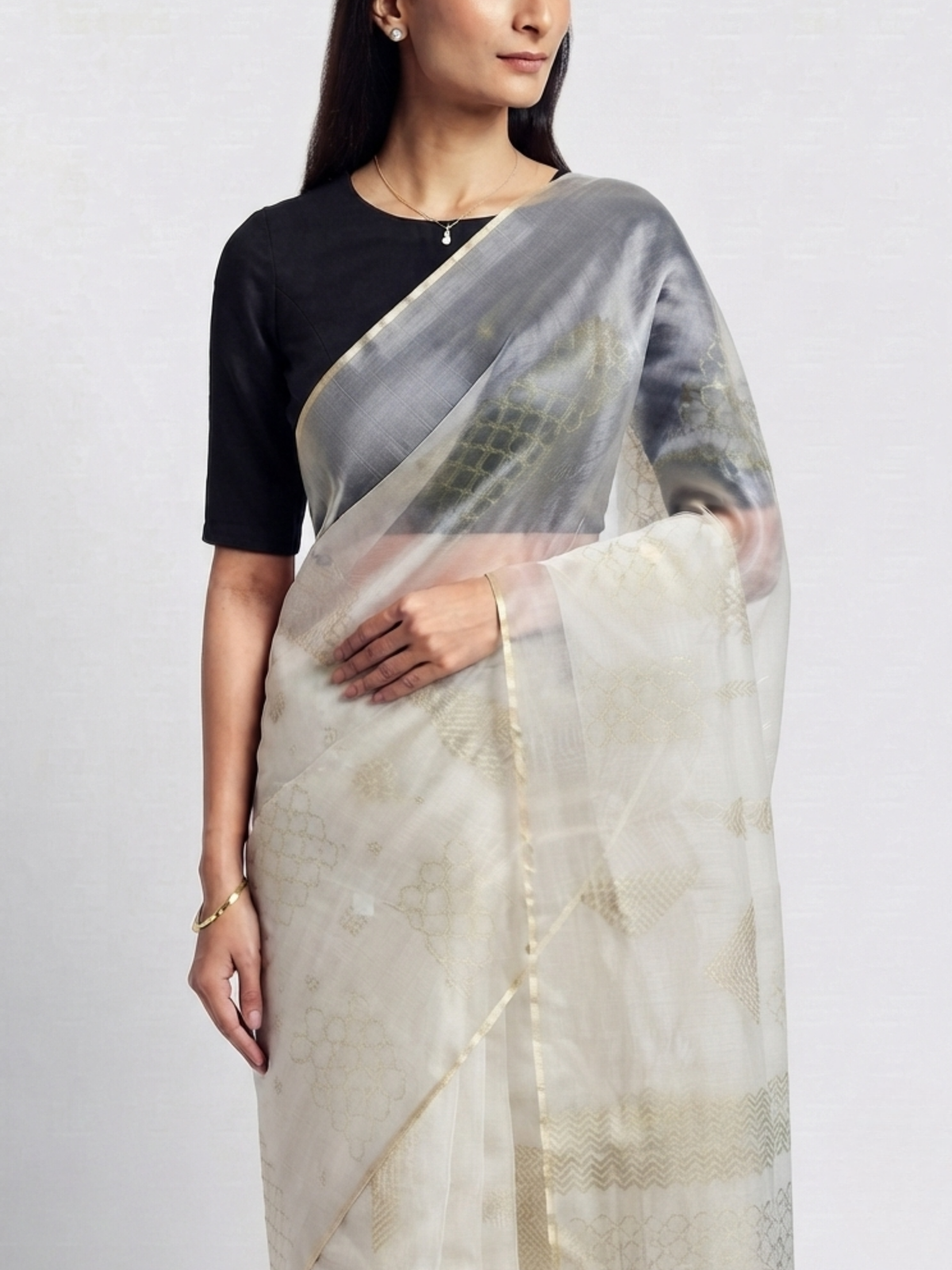 SoulWeaves Chandini ivory organza silk saree with delicate geometric motifs and subtle golden border.