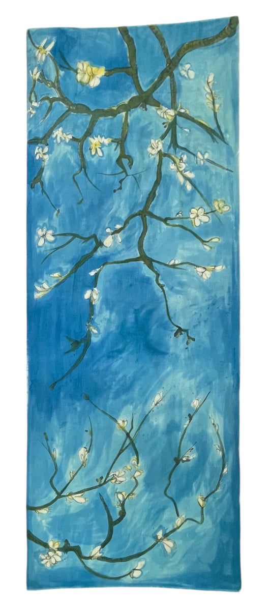 Decorative scarf with floral branch design on a blue background. Blue Hanami Scraf by Soulweaves